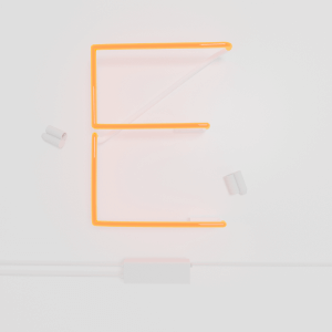 glass neon sign with white cable