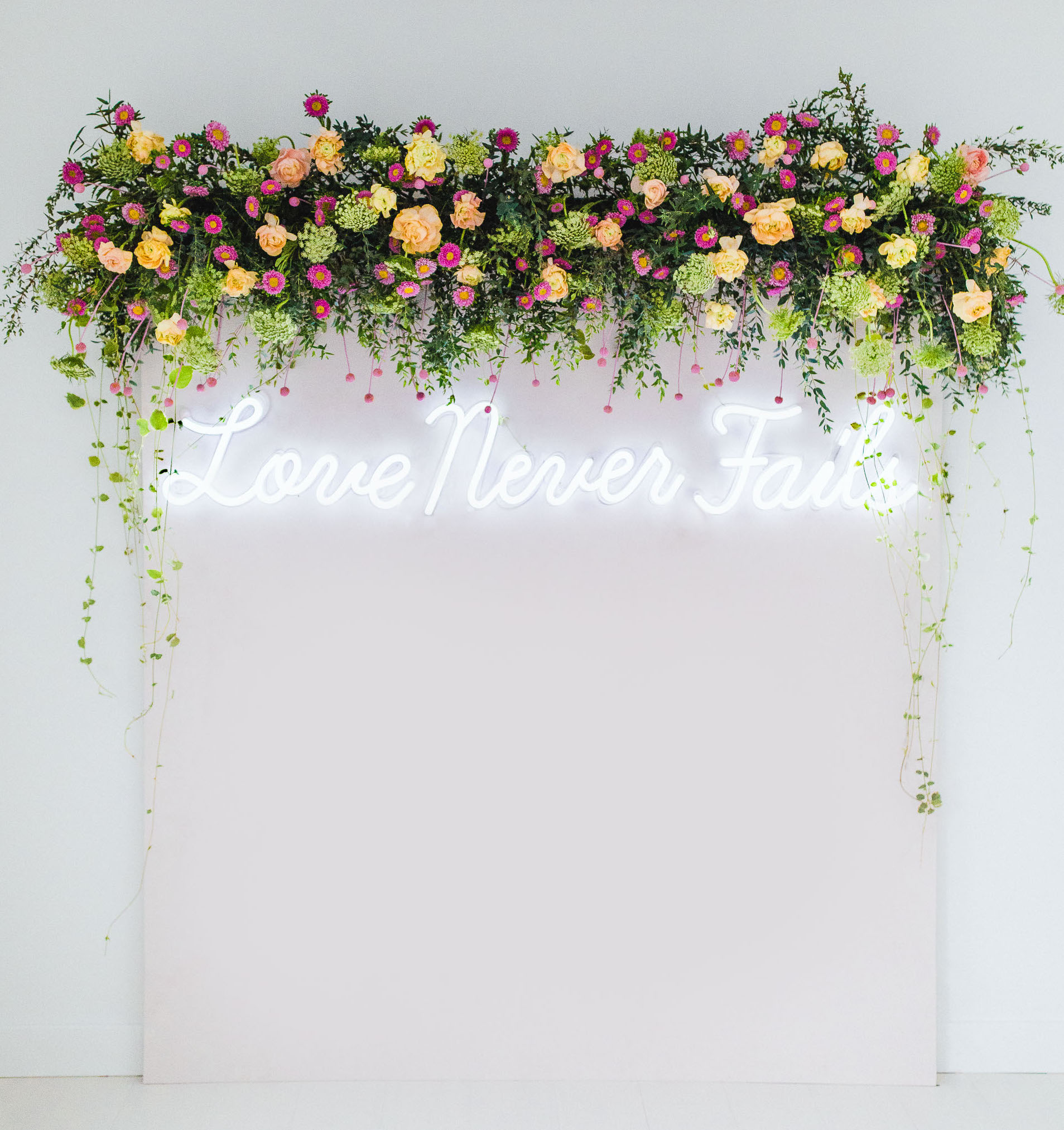 love never fails neon sign