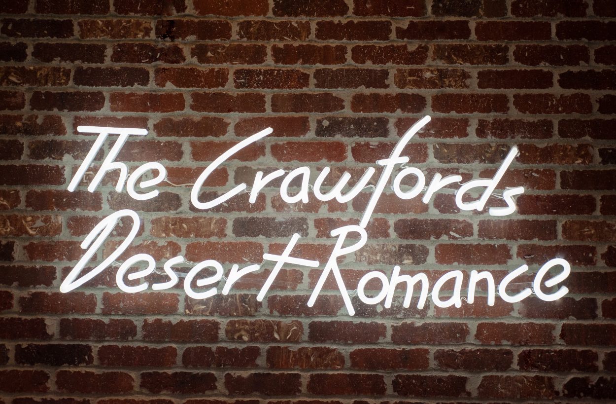 the Crawfords Desert Romance neon sign