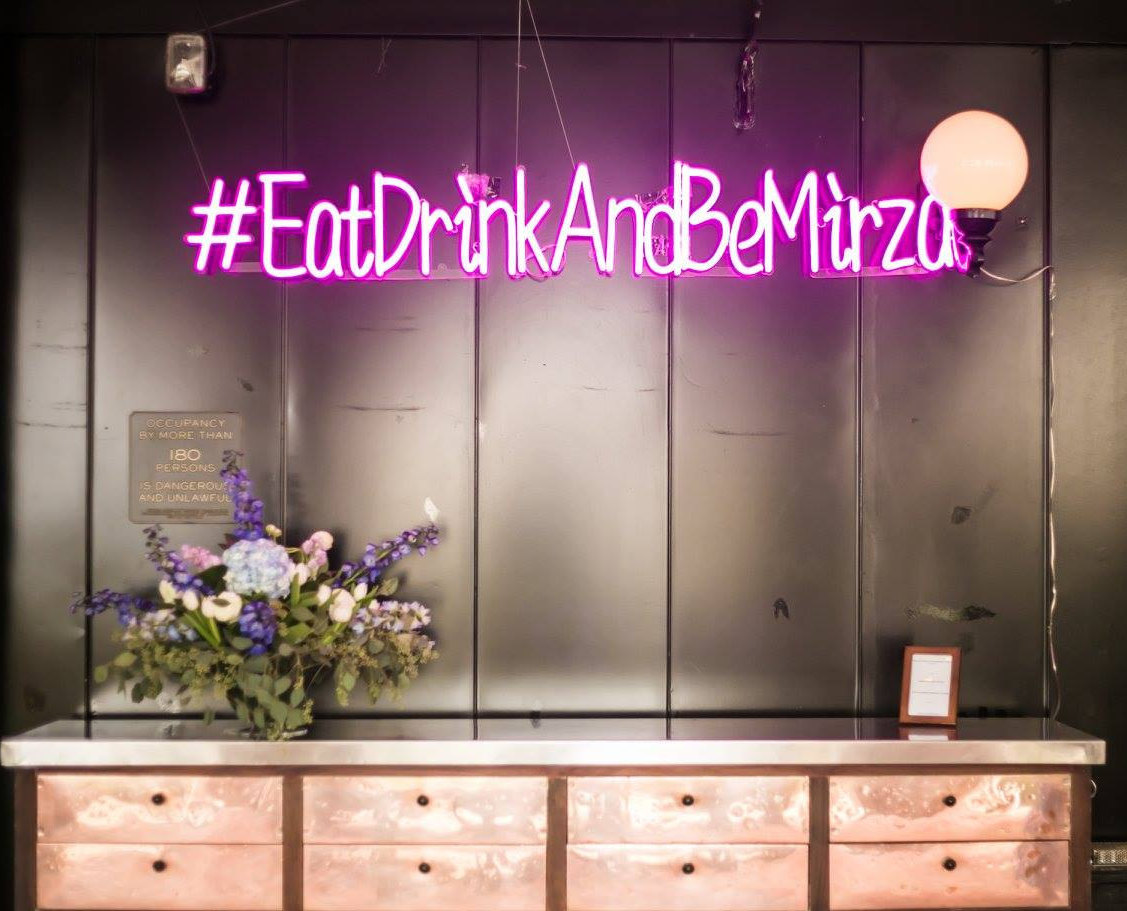 #EatDrinkAndBeMirza neon sign