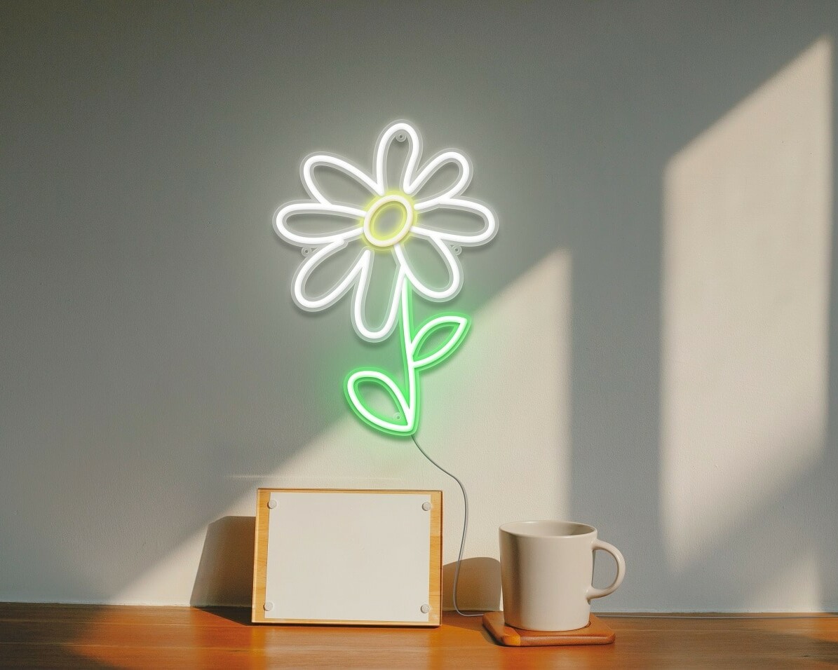 A gorgeous neon sign of a daisy flower, in white and green