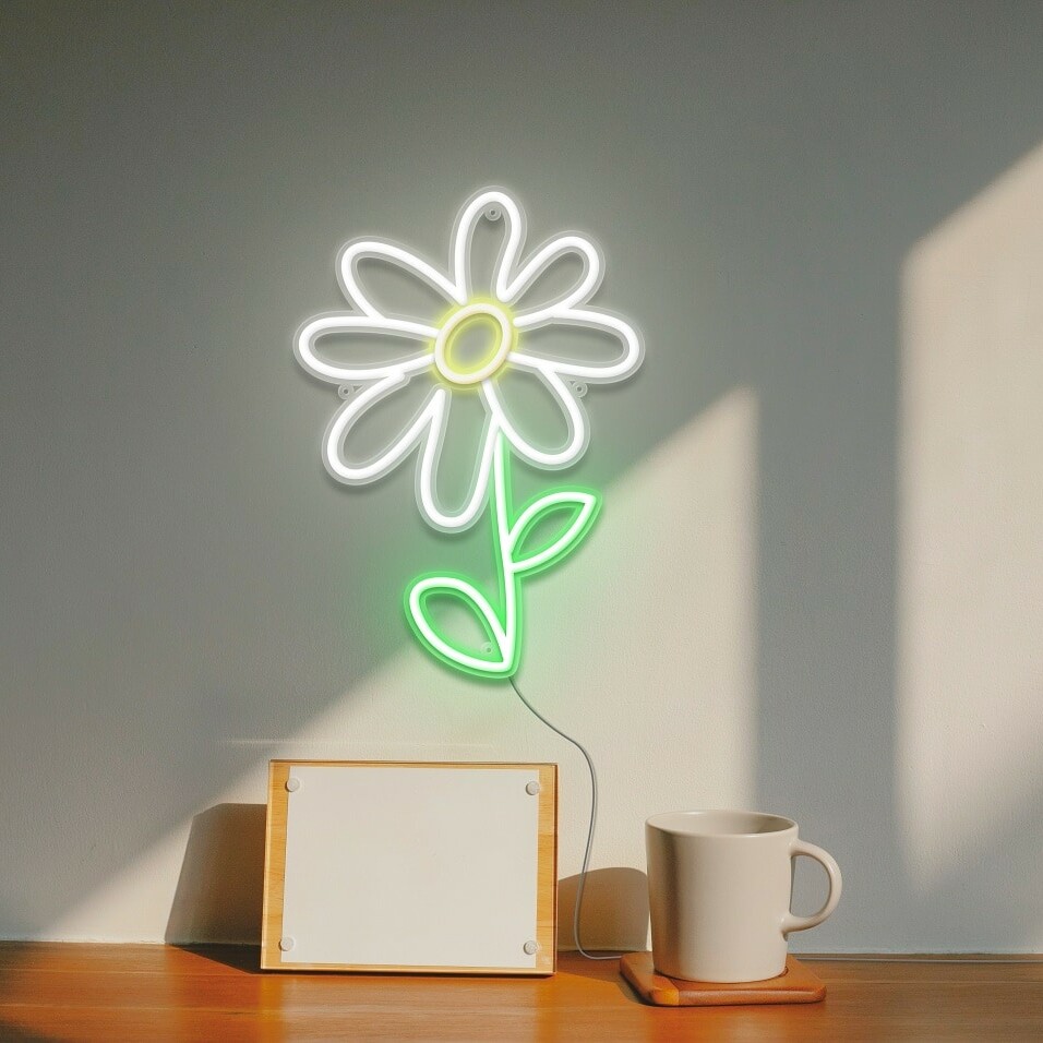 A gorgeous neon sign of a daisy flower, in white and green