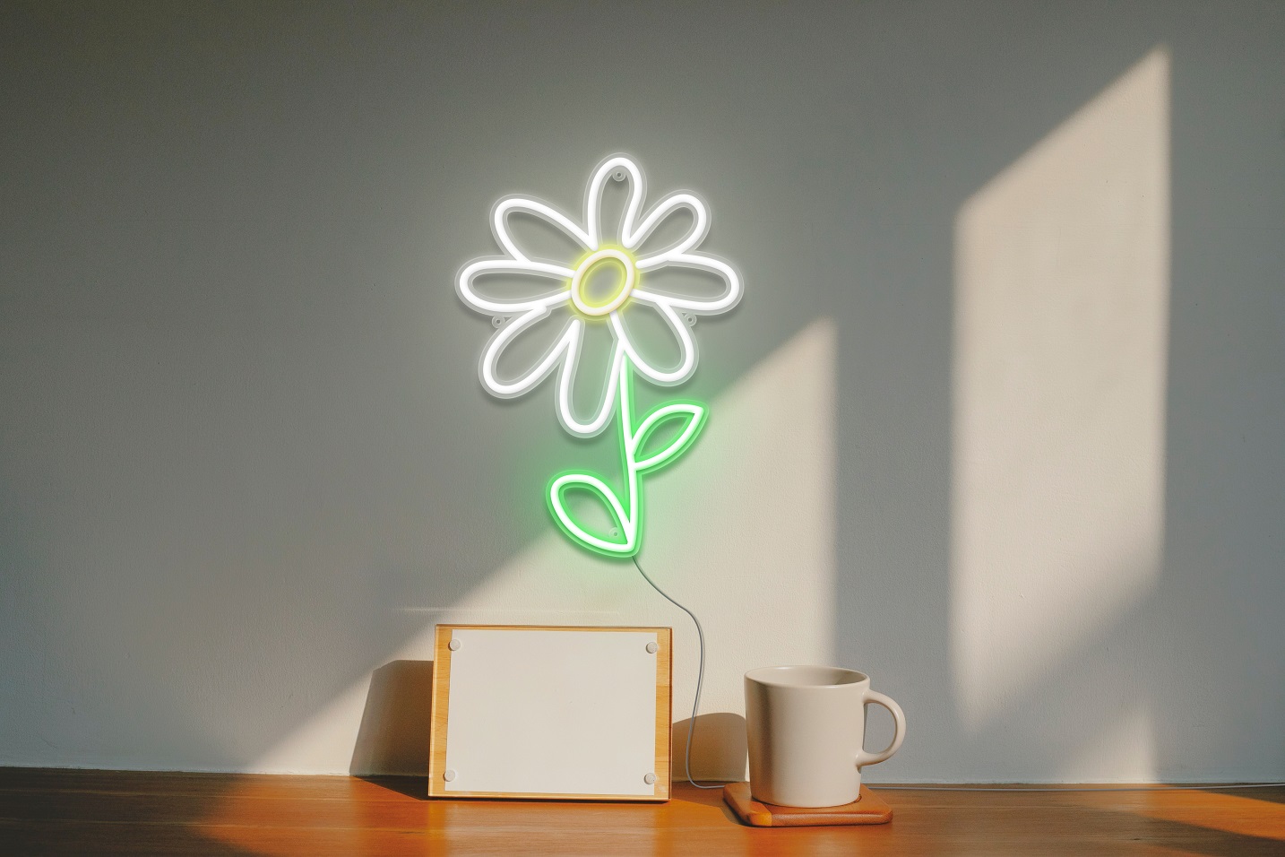 A gorgeous neon sign of a daisy flower, in white and green