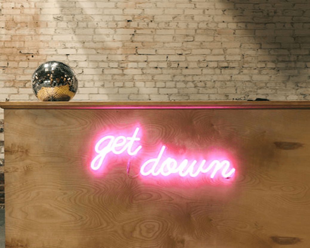 light pink neon sign on the wall