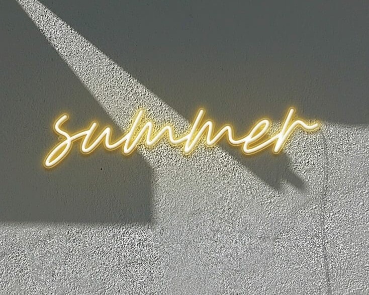 A minimalist neon sign of sunlight in the day