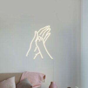 A cute and charming neon sign of a paw print and hand shape for your bedroom