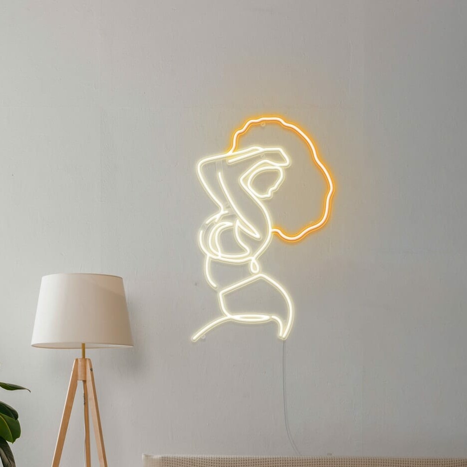 A playful neon sign of a woman striking a pose on a wall