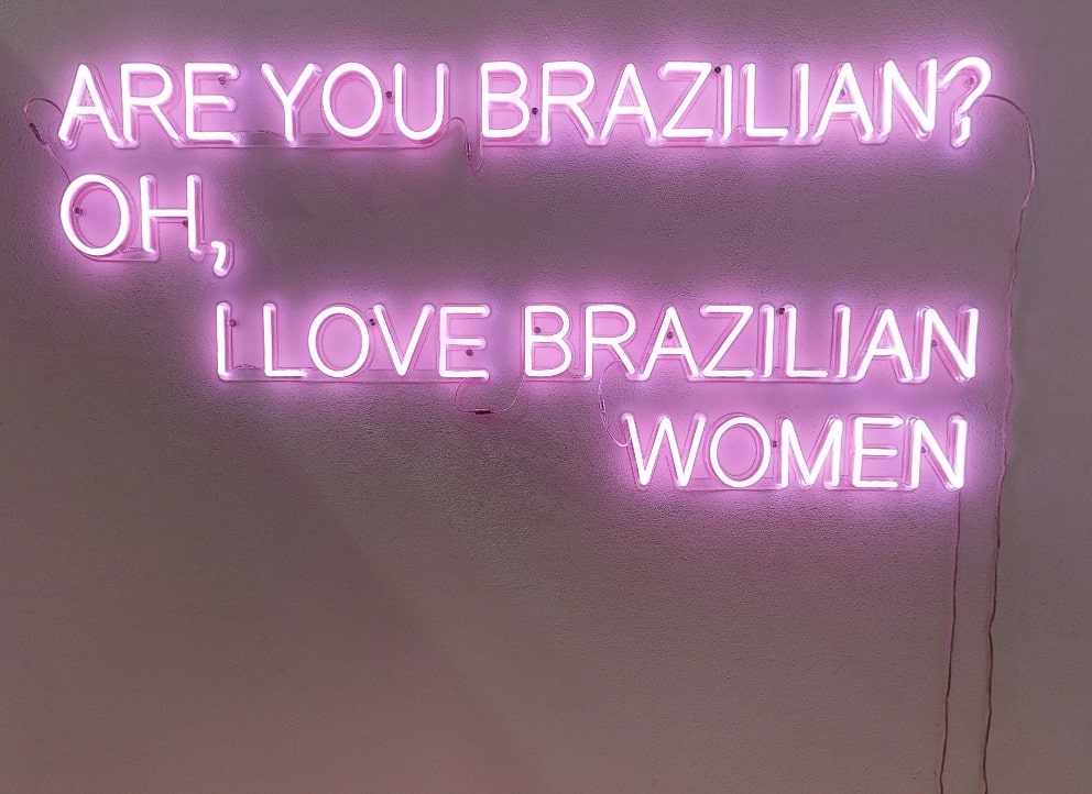pink neon sign on wall