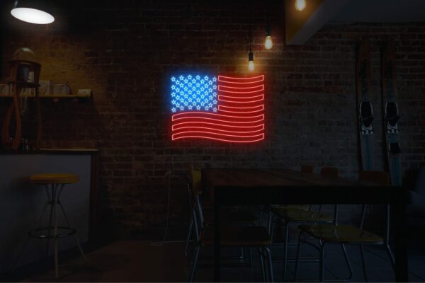 A patriotic neon sign of the US flag, in red for hotels and cafes