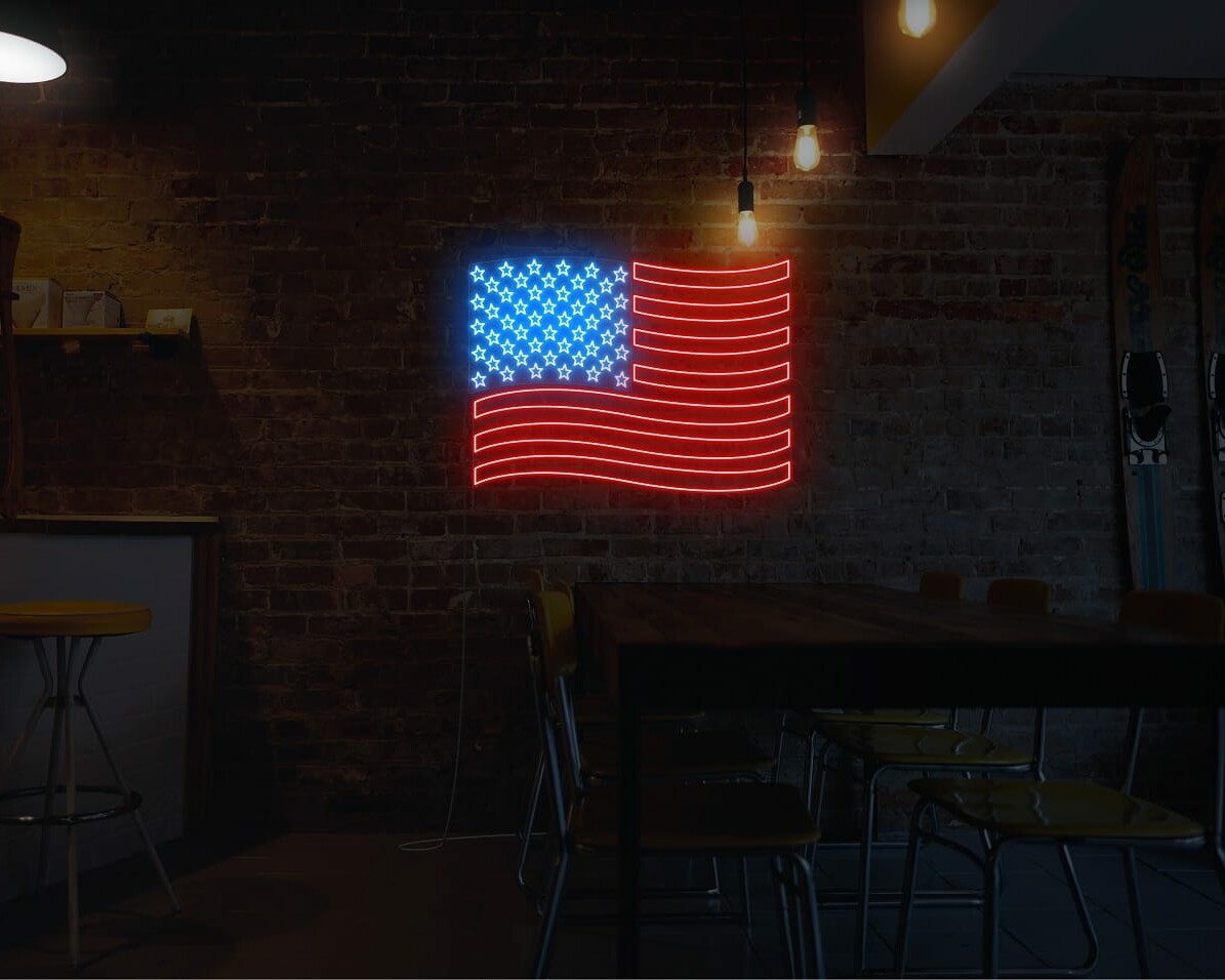 A patriotic neon sign of the US flag, in red for hotels and cafes