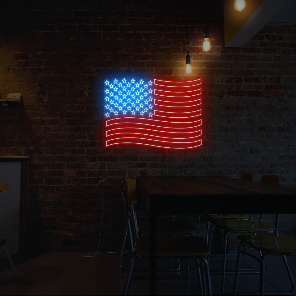 A patriotic neon sign of the US flag, in red for hotels and cafes