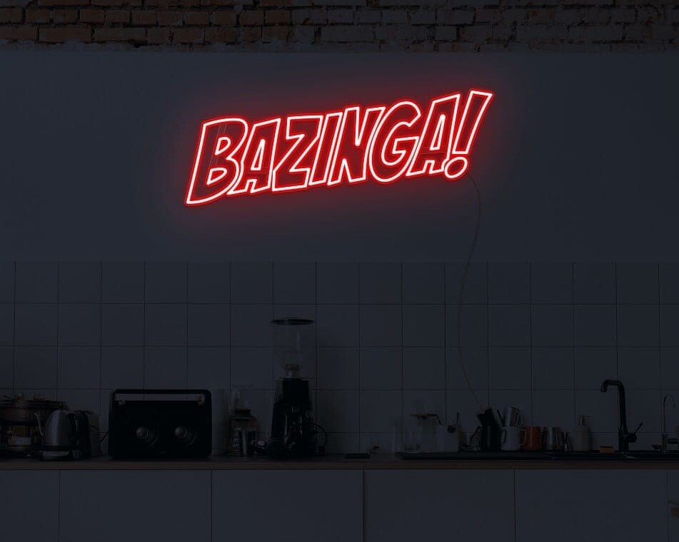 A vibrant neon light of 'Bazinga' on a wall