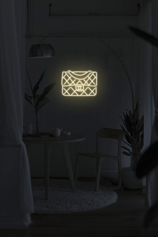A fun and playful neon sign of a handbag for your walls