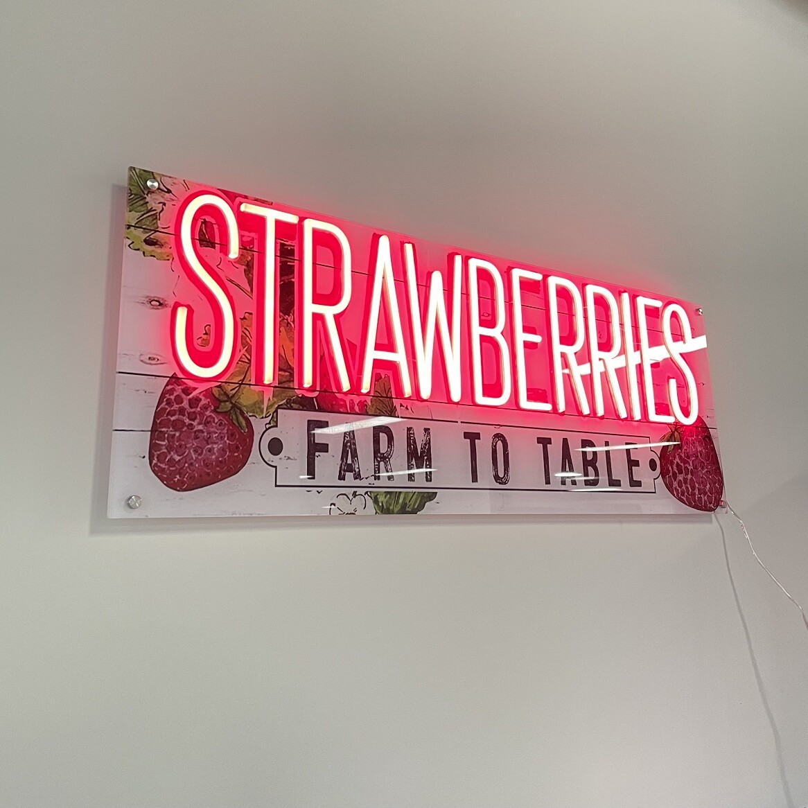 red strawberry neon light