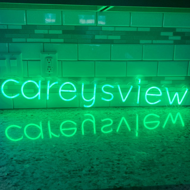 green neon light wall art