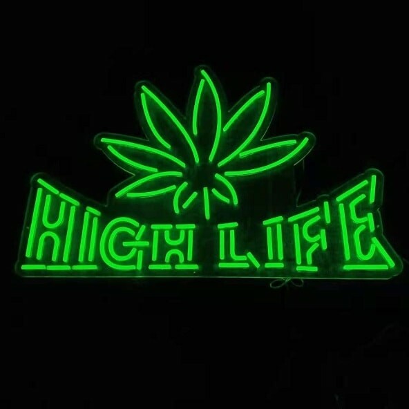 leaft shaped green logo neon sign