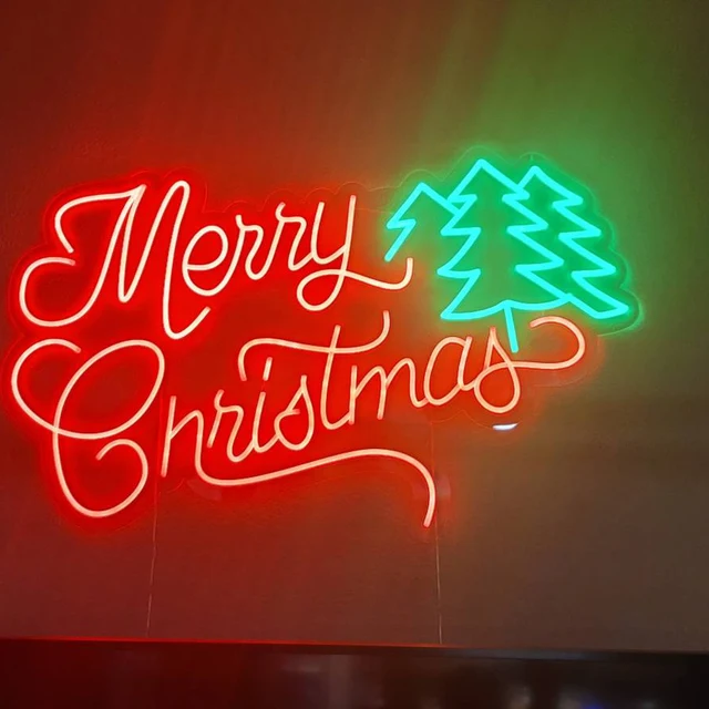 red merry christmas neon light with green trees