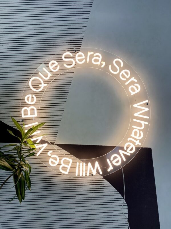 soft white custom neon sign que sera sera. custom quote neon sign