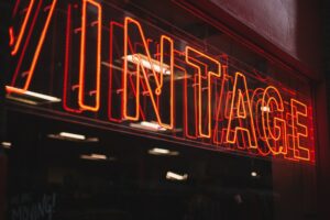 Vintage neon sign mirror on glass wall