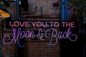 red and purple vintage neon light signage