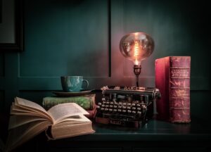 table with vintage lamp book typewriter