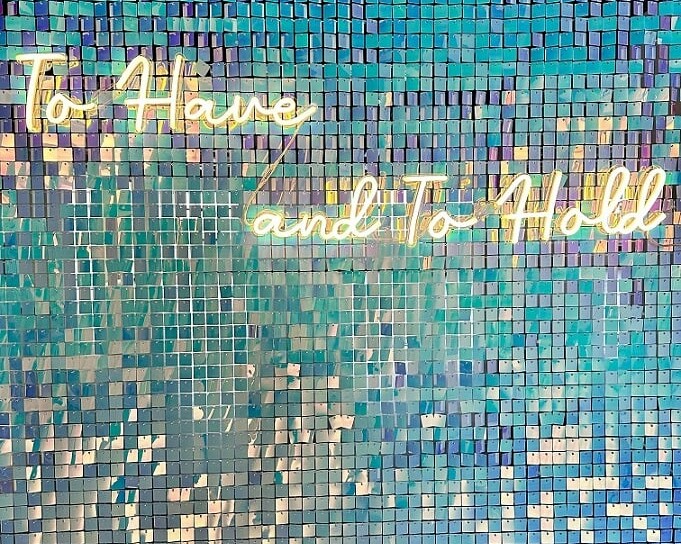 to have and to hold neon sign on shimmer wall