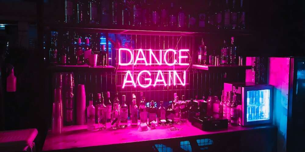 dance again pink bar glass neon sign