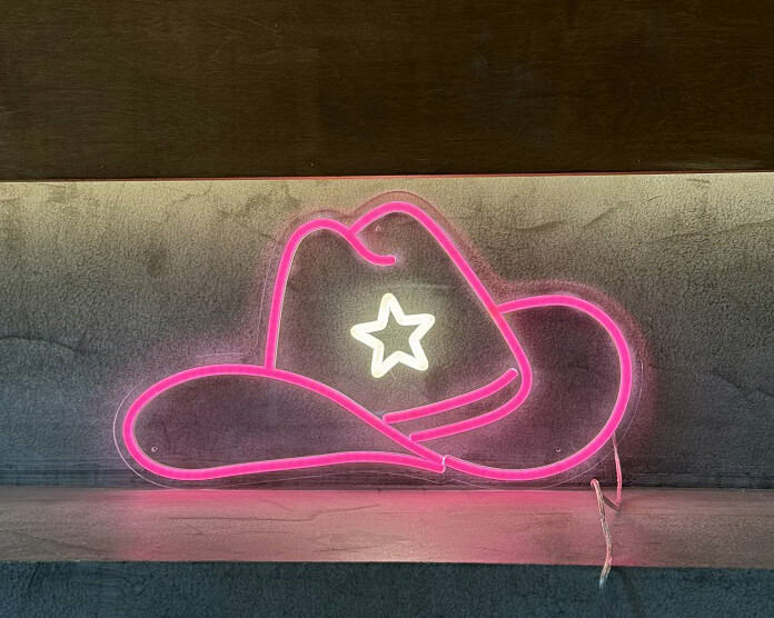 pink cowgirl hat pink neon sign