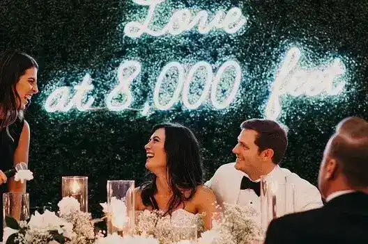 wedding party neon sign on green wall