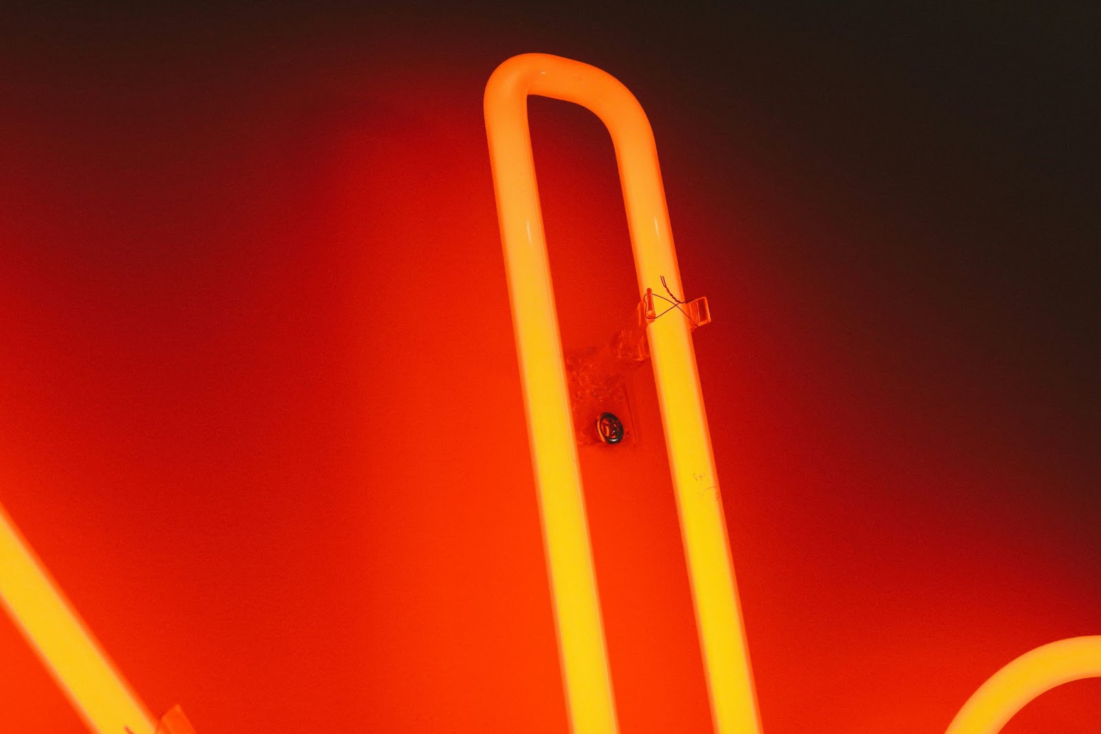 fine detail of red glass neon sign