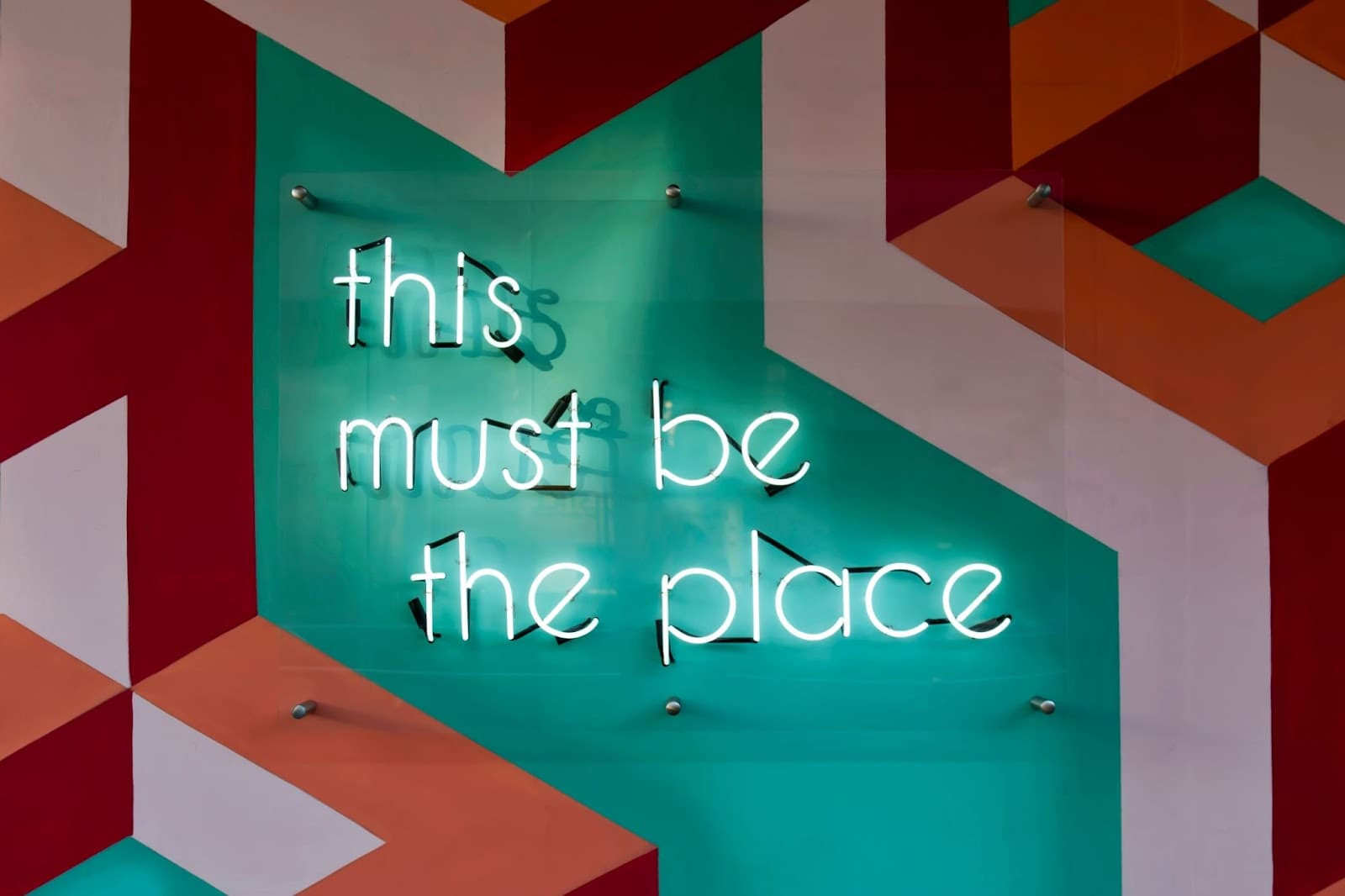 this must be the place glass neon sign mounted on wall