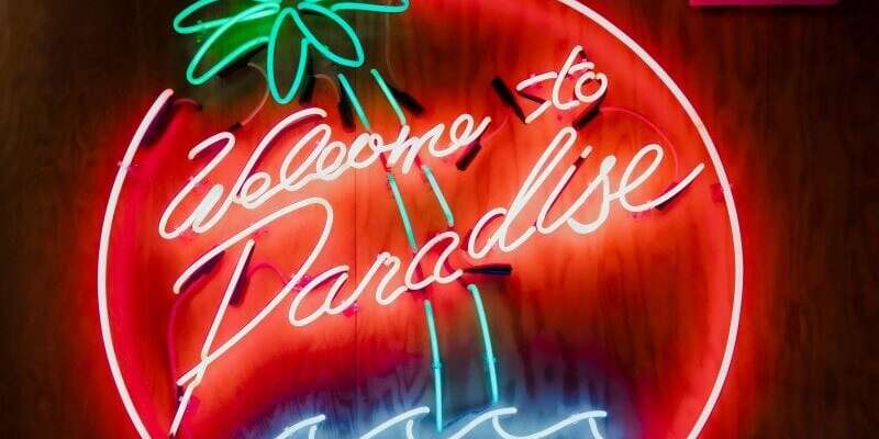 glass neon party sign welcome to paradise