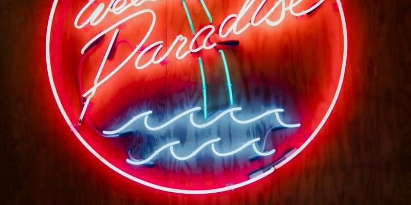 glass neon party sign welcome to paradise