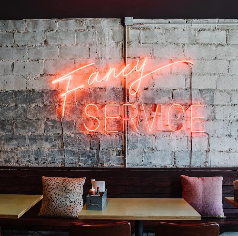 bon ton atlanta restaurant glass neon sign wall decor