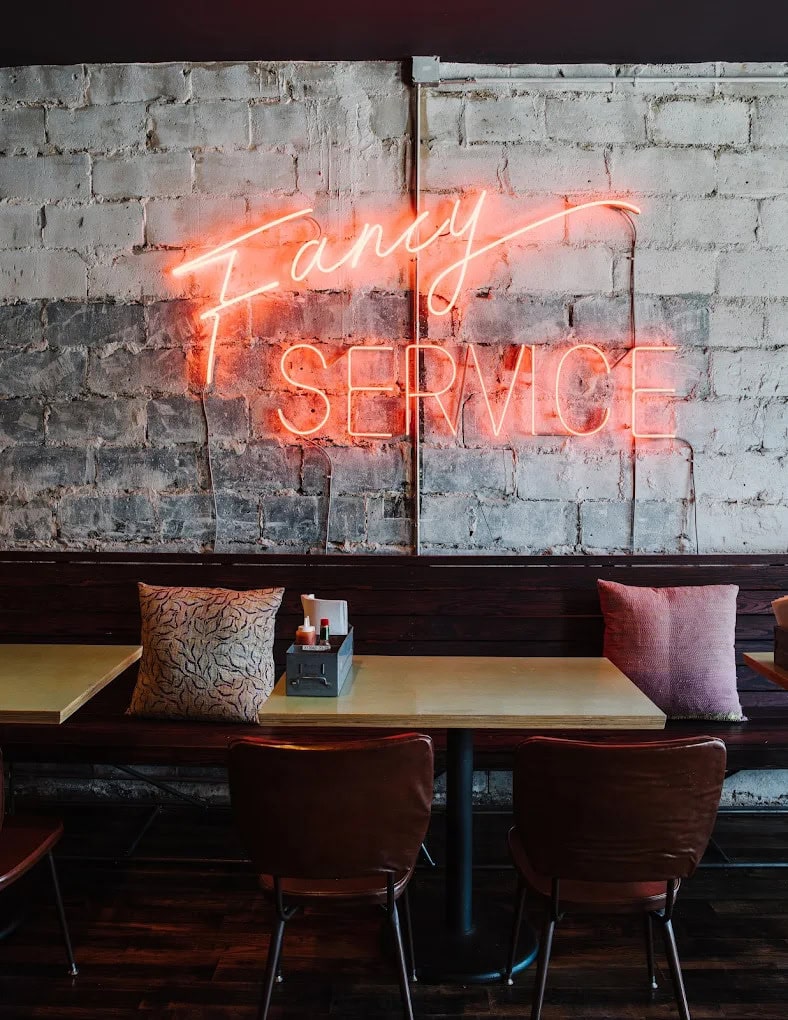 bon ton atlanta restaurant glass neon sign wall decor