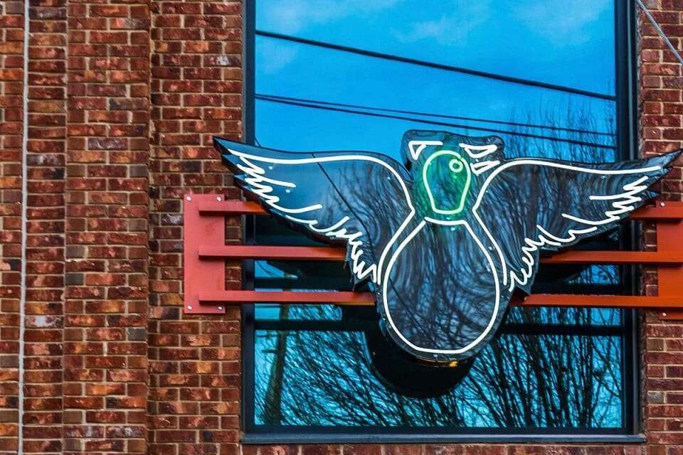 painted duck Atlanta outdoor logo glass neon sign