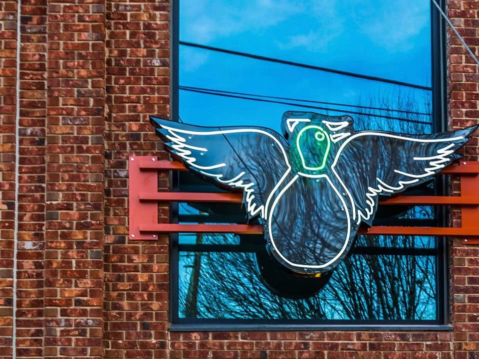 painted duck Atlanta outdoor logo glass neon sign