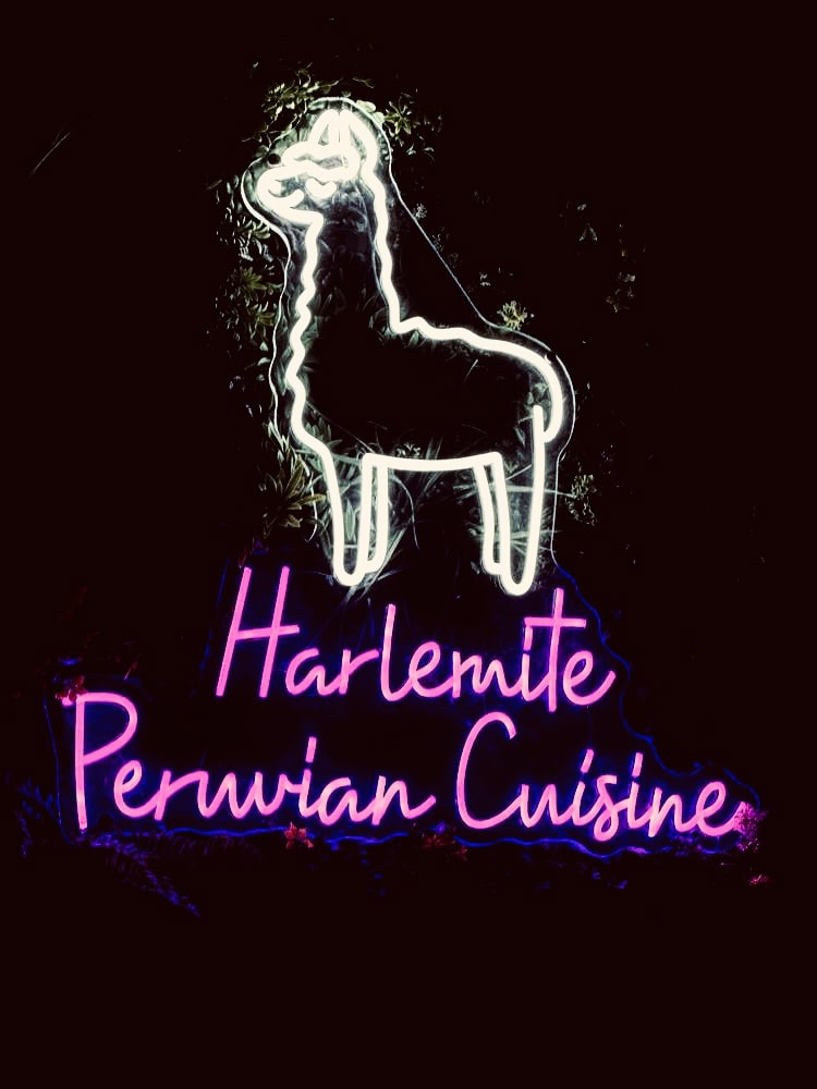 Harlemite Peruvian Cuisine white and pink neon sign