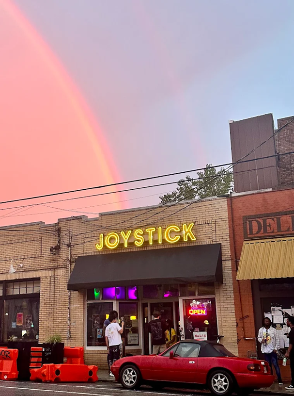 Joystick outside glass outdoor neon sign