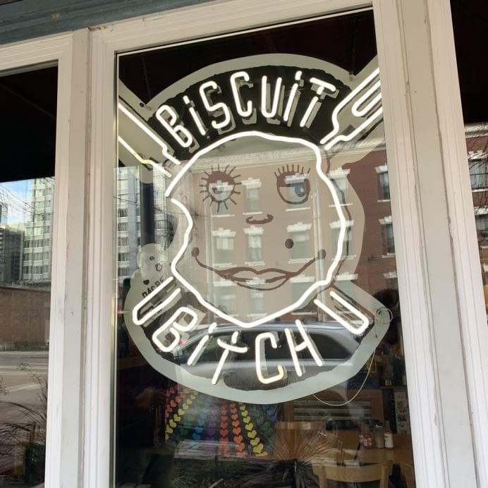 glass vintage neon sign in biscuit restaurant
