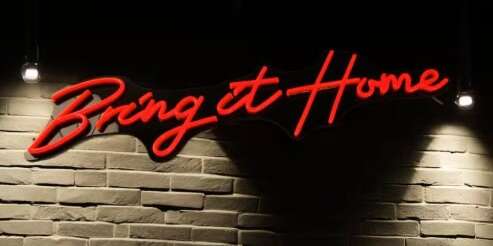 red neon sign on dark background