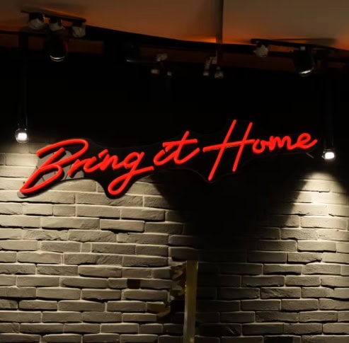red neon sign on dark background