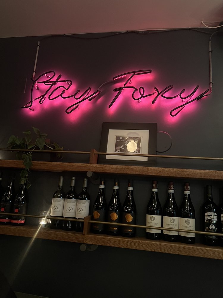 Fox & The Knife restaurant neon sign in Boston