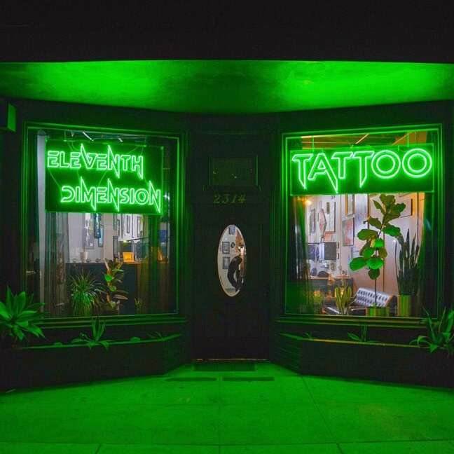 green vintage glass neon sign for tattoo business window