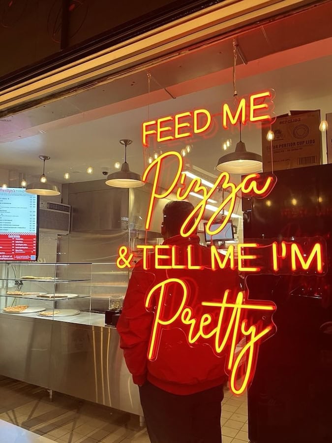 marilyn's pizza feed me pizza restaurant neon sign
