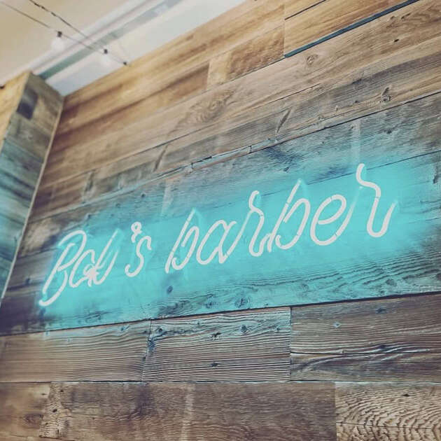teal custom glass neon sign for barber shop