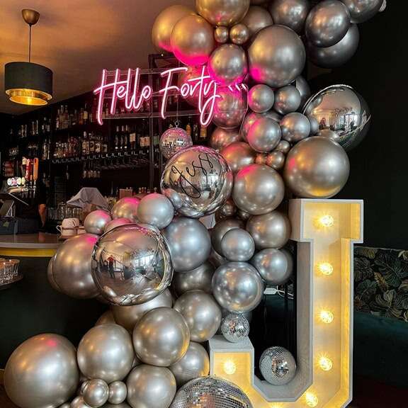 custom birthday neon sign with balloon decor