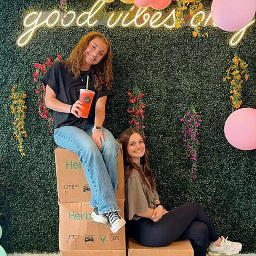 custom neon sign backdrop for influencer photo