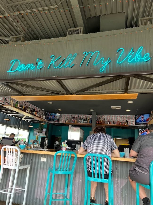 don't kill my vibe bar neon sign in REV Mex in oklahoma