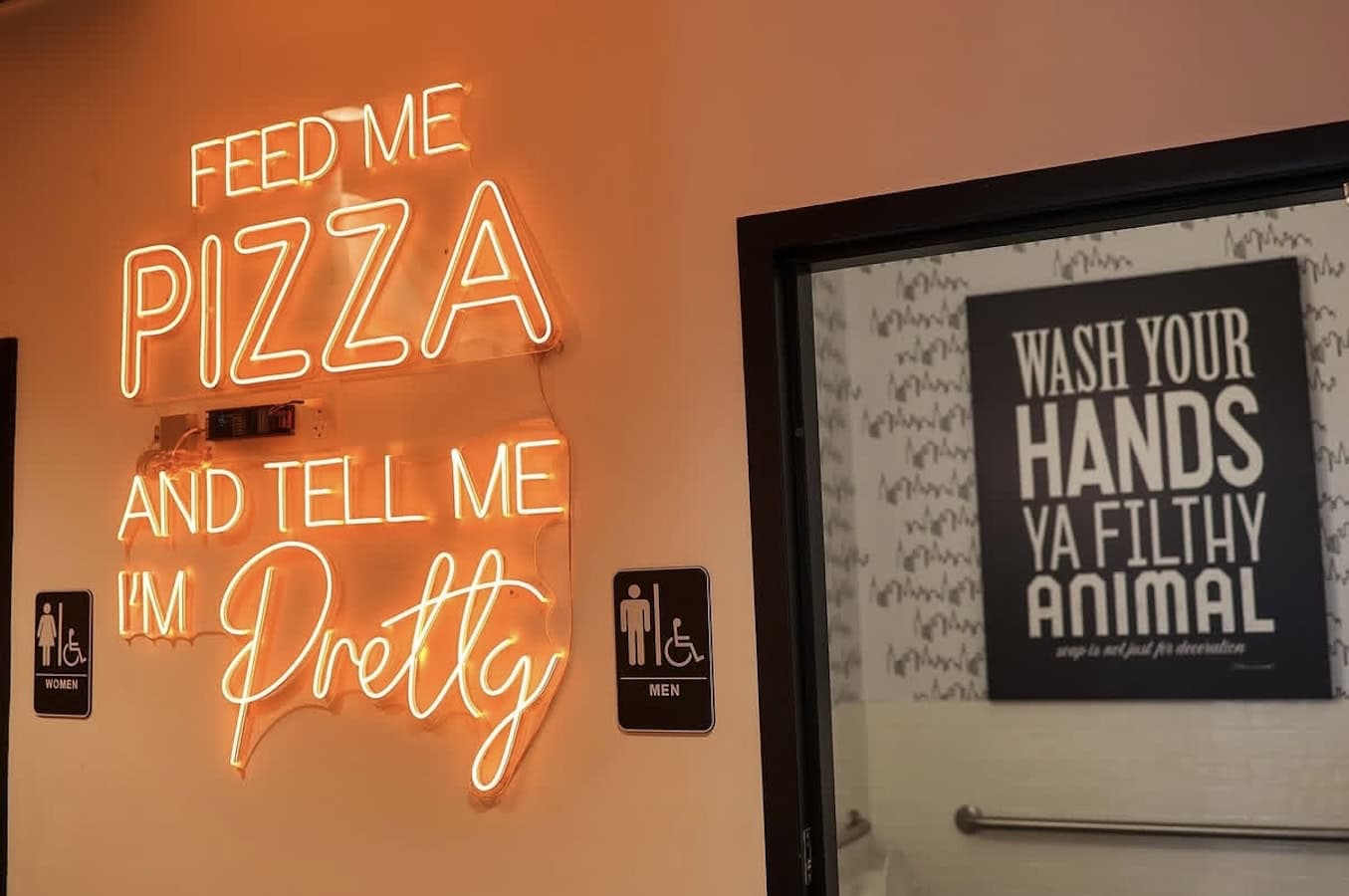 feed me pizza and tell me I'm pretty restaurant neon sign in Washington